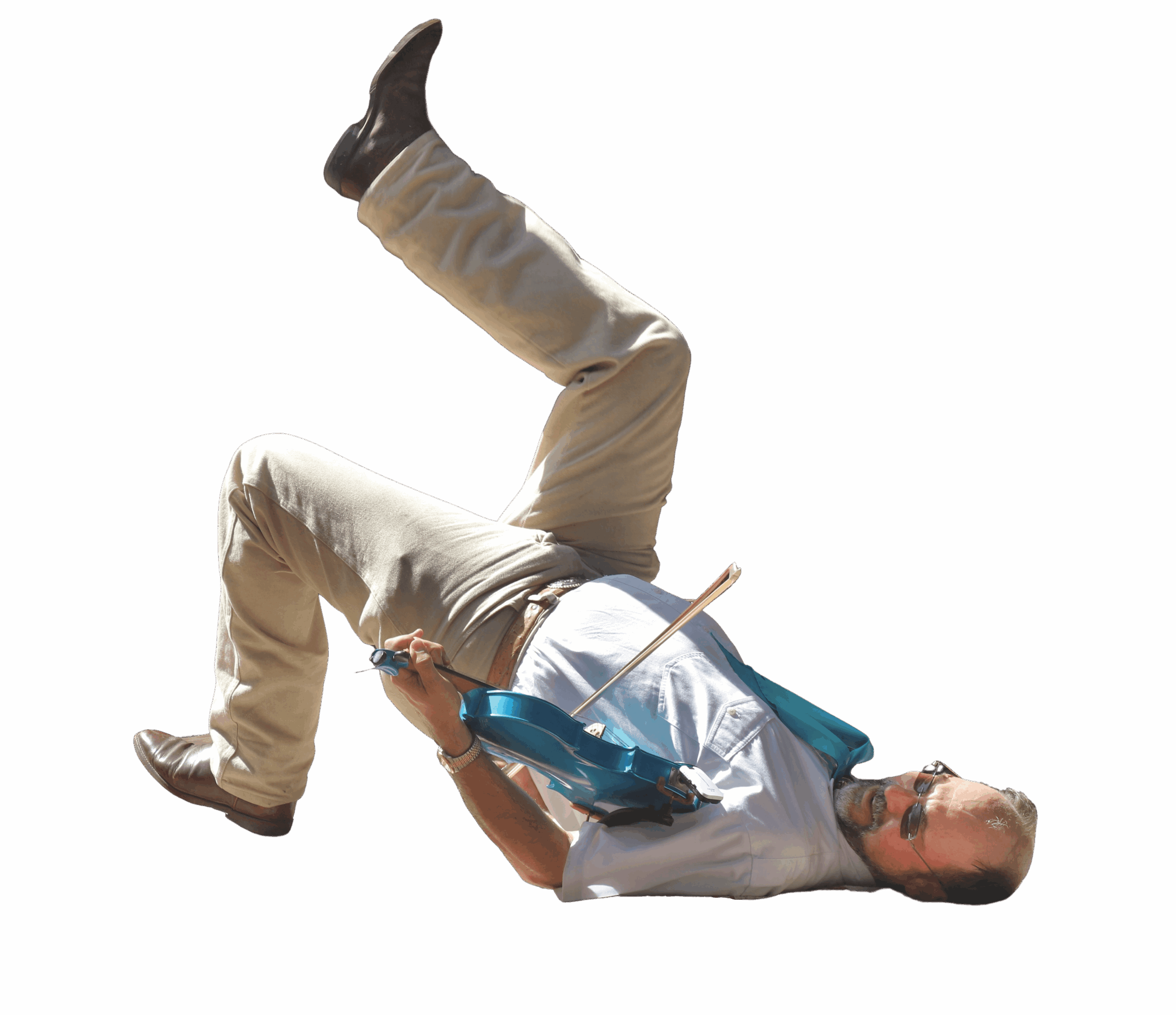 Person lying on their back with legs raised and head tilted, holding a guitar, against a black background.
