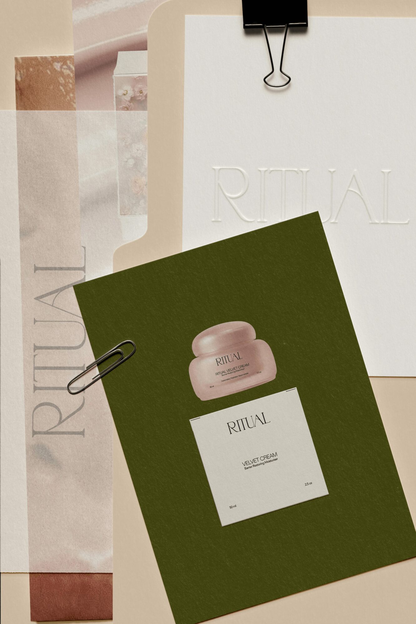 Two paper sheets, one white and one dark green, with a jar image and text, clipped to a background with other papers.