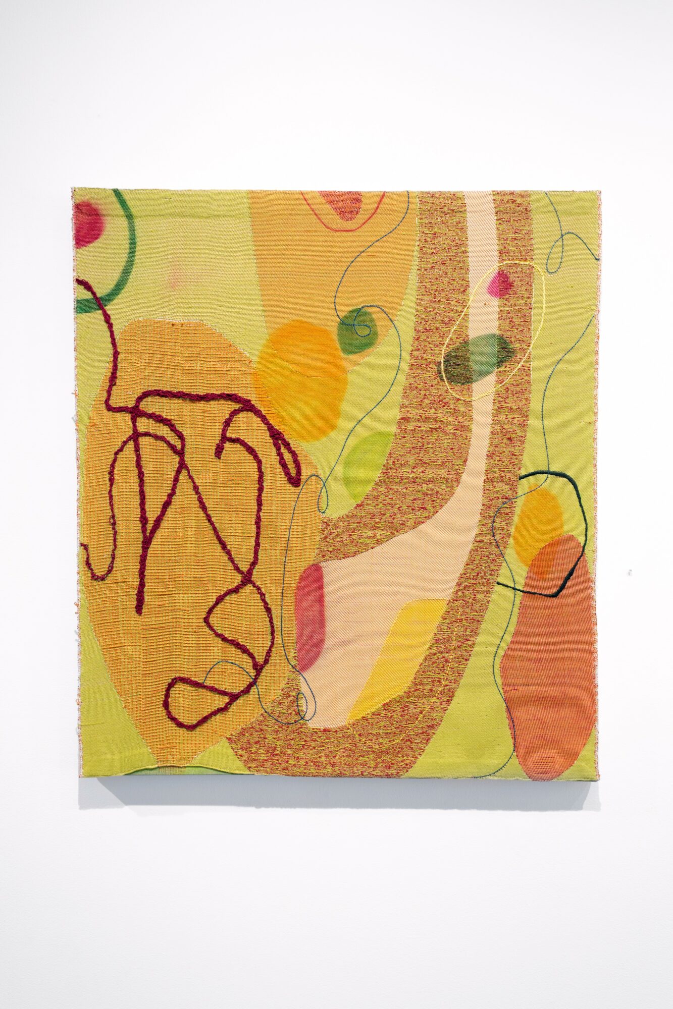 Abstract colorful artwork with curved lines and shapes on a yellow background.