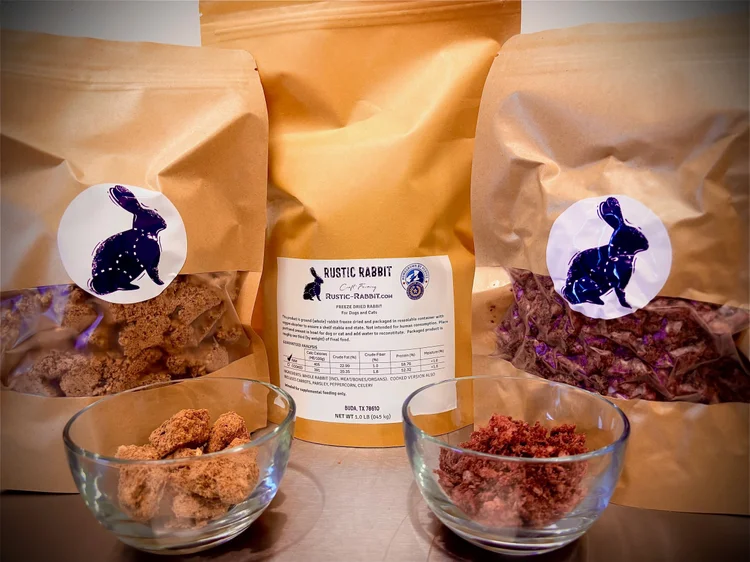 Three brown paper bags with rabbit logos and two glass bowls containing different types of food, on a flat surface.
