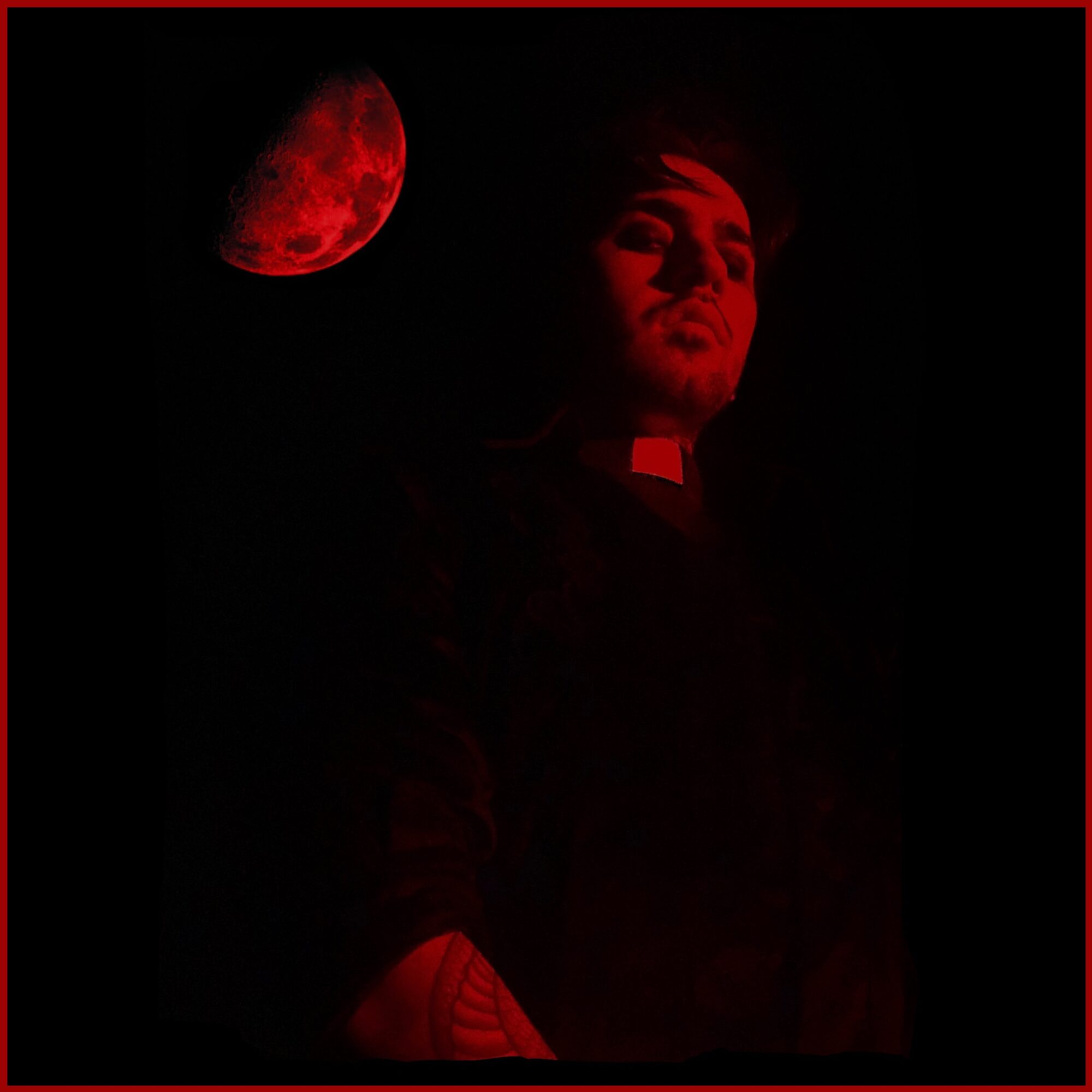 Person with illuminated face and a red moon in the dark background, red border, low lighting, serious expression.