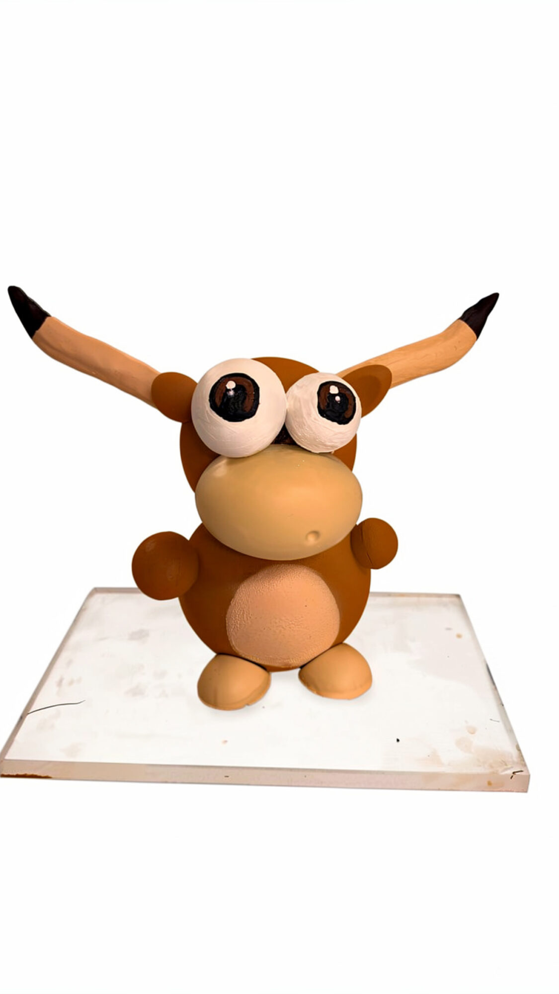 Cartoonish creature with large eyes, long ears, and a round body, standing on a white platform.