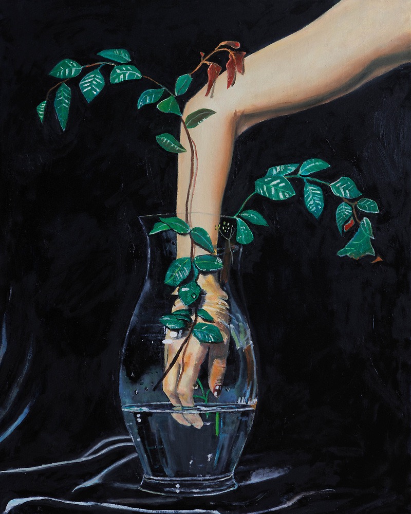 A hand emerges from a vase with green leaves and a small plant, set against a dark background.