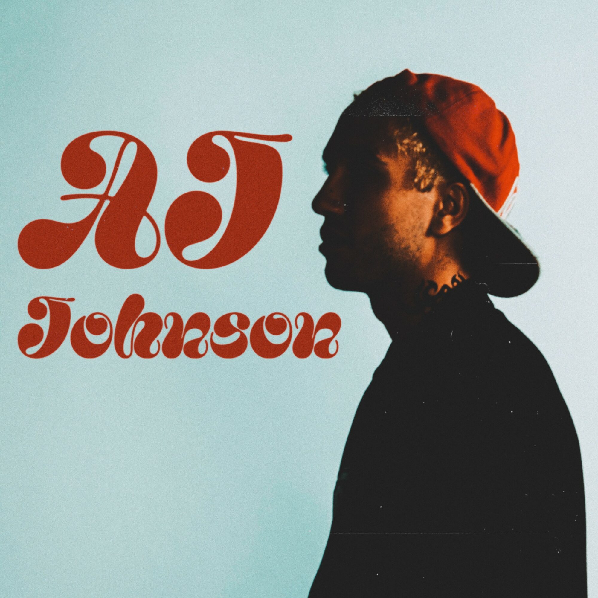 Silhouette of a person wearing a red cap, facing right, with stylized text reading 'AJ Johnson' on a light background.