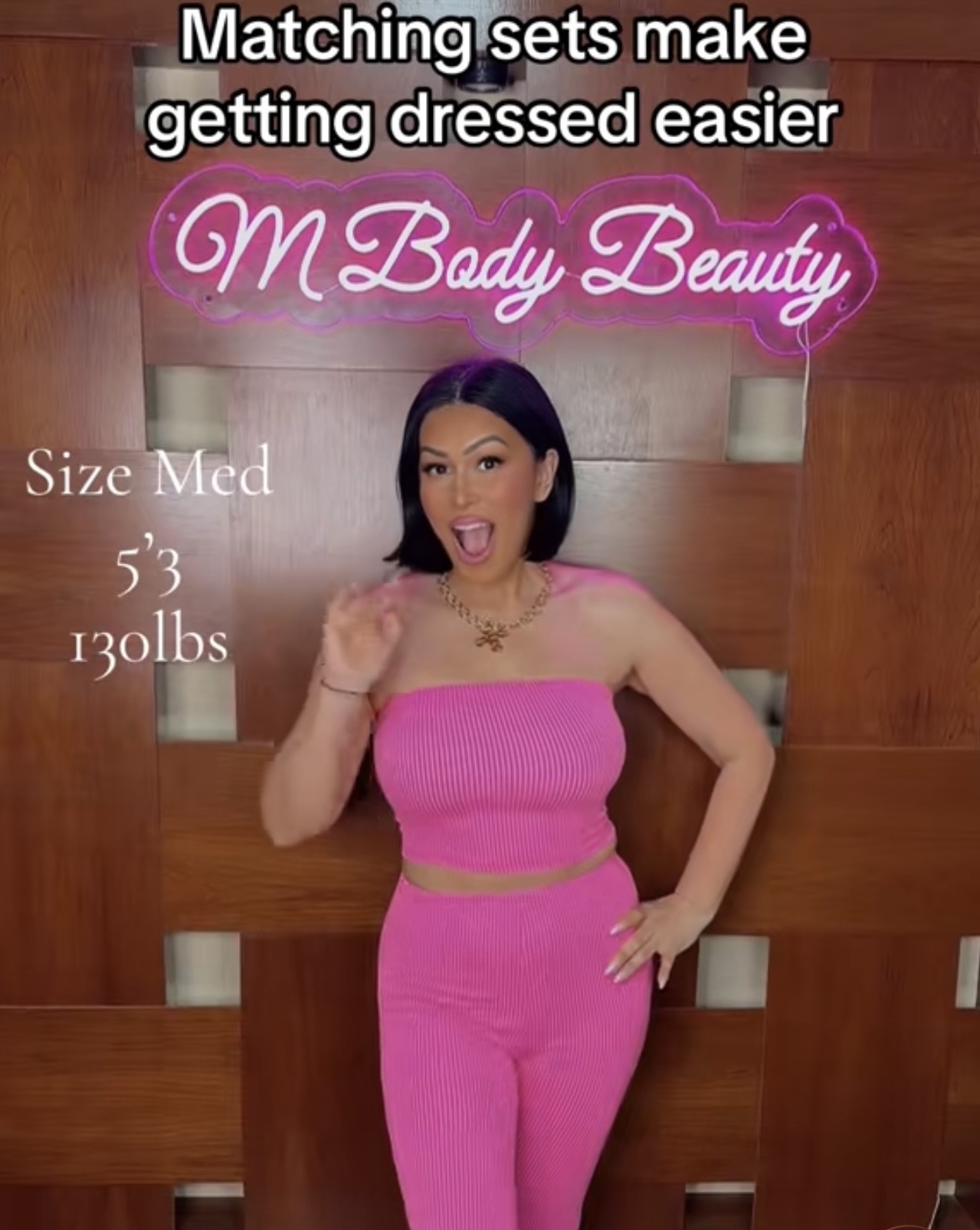 Woman in pink matching set posing indoors, smiling, with text about matching sets and beauty, size medium, 5'3