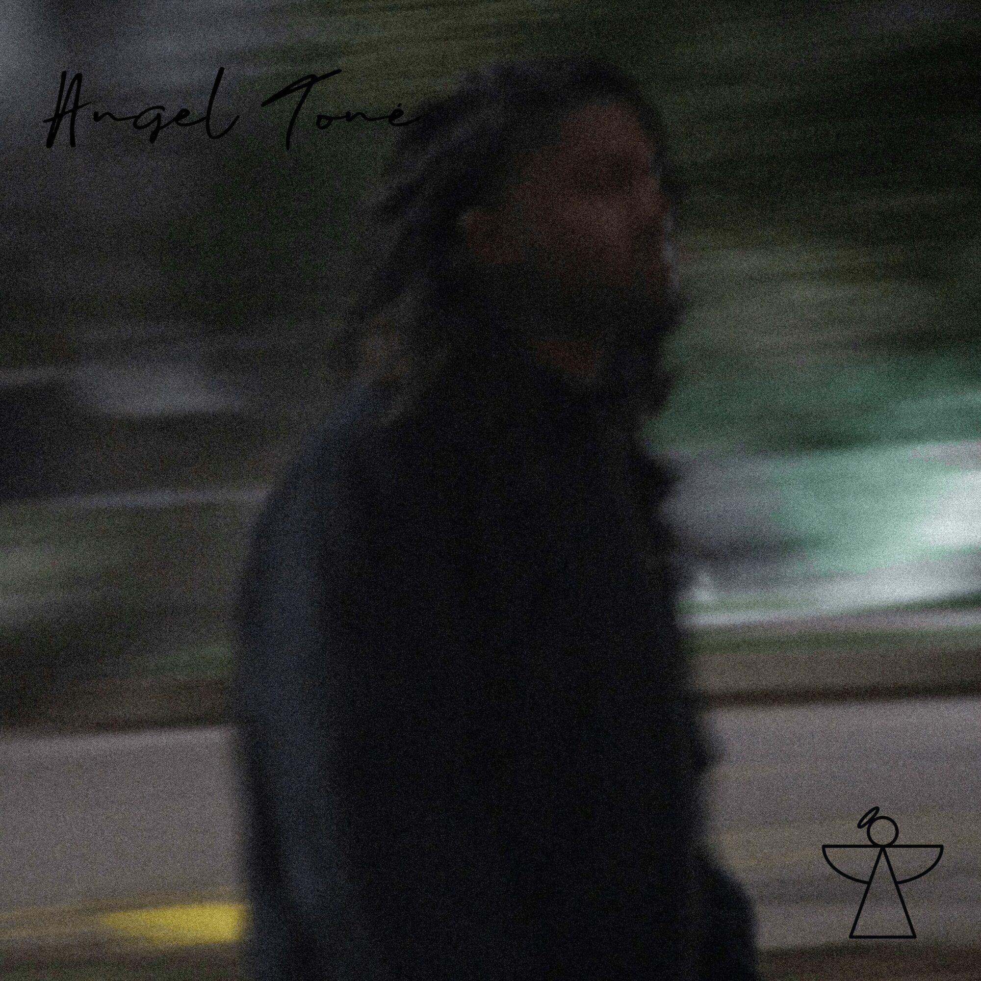 Person with dreadlocks walking outdoors, background with trees and a road, blurry motion effect.