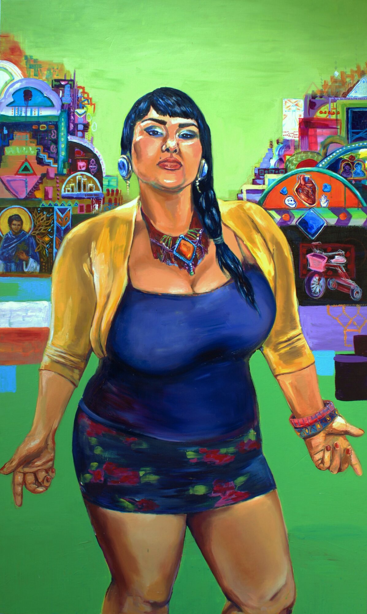 Portrait of a woman with long dark hair, wearing a blue top, yellow jacket, and colorful skirt, standing in front of colorful buildings.