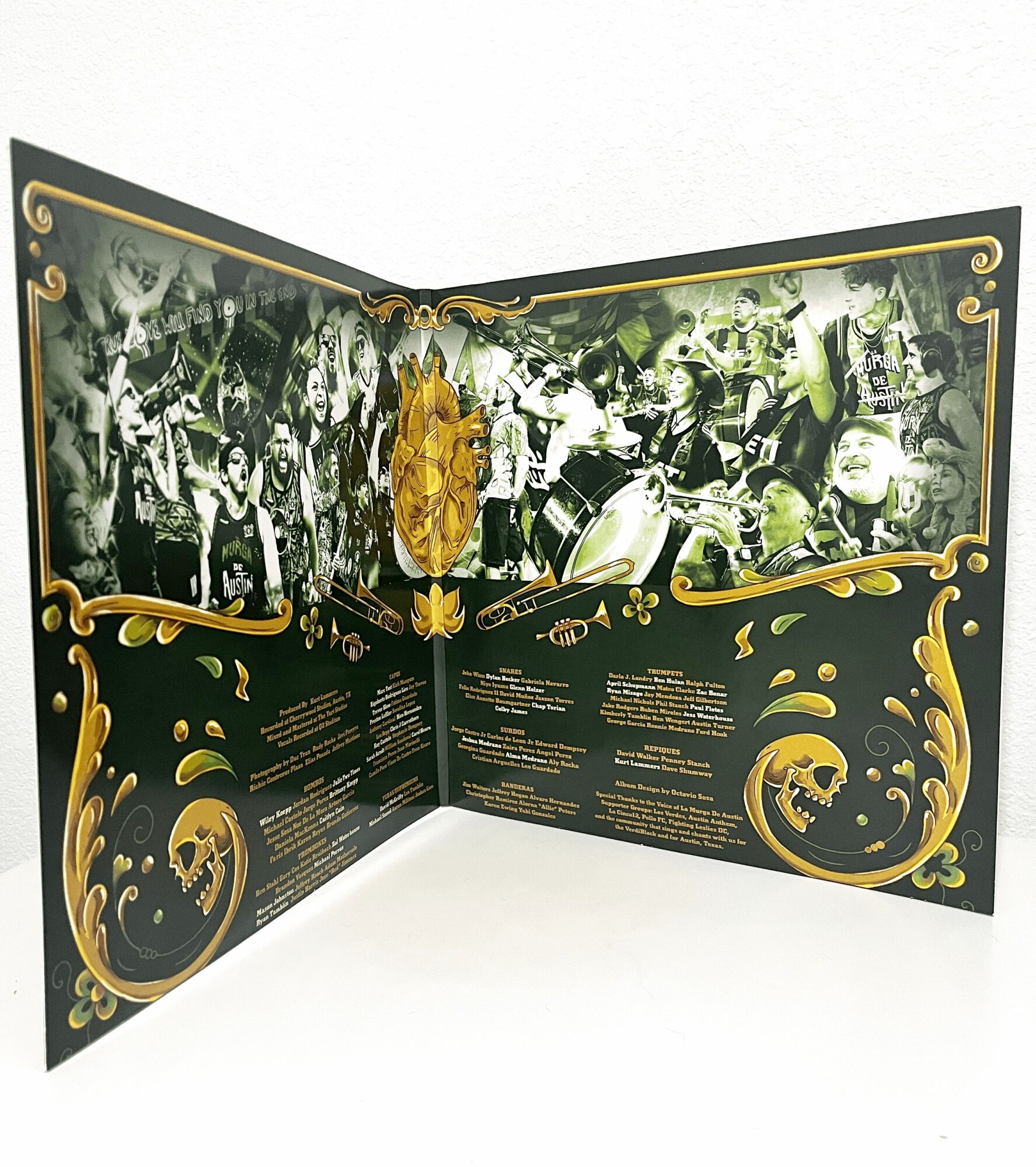 Open booklet with black and gold design, containing black-and-white photos of people and text on dark background.
