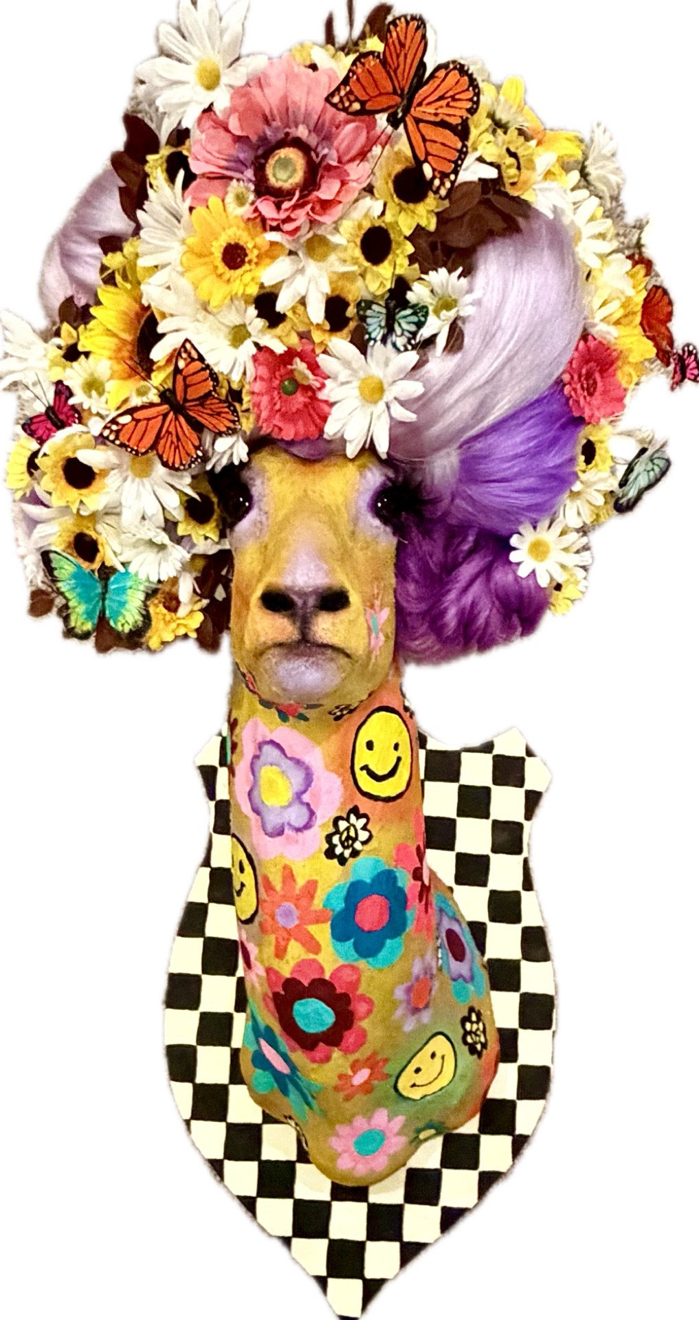 Dog with a floral headpiece, colorful clothing, and a checkered background, surrounded by butterflies and flowers.