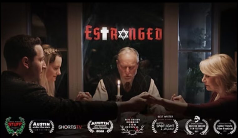Group of five people sitting around a table, with a window and a sign reading 'ESTRANGED' behind them.