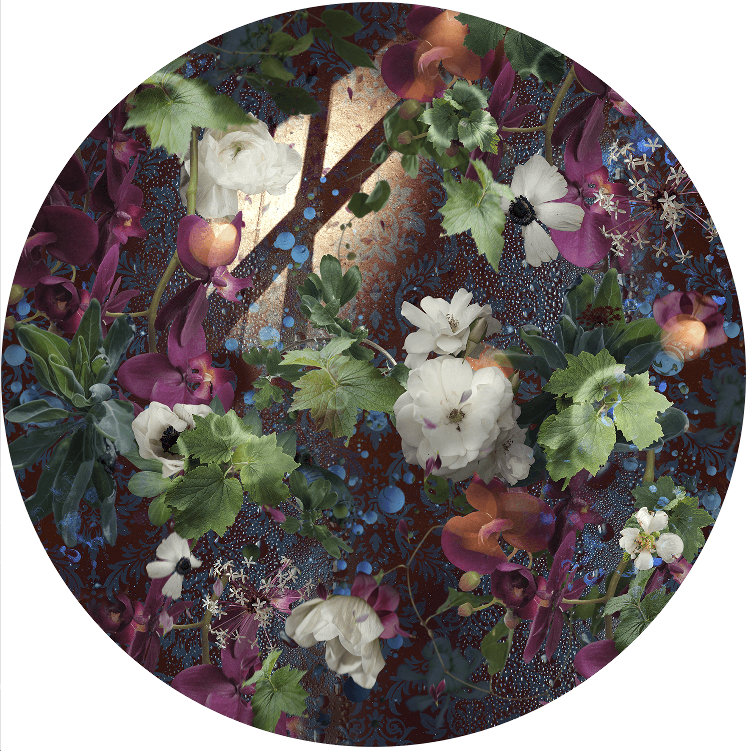 Colorful floral arrangement with various flowers and greenery in a circular frame.