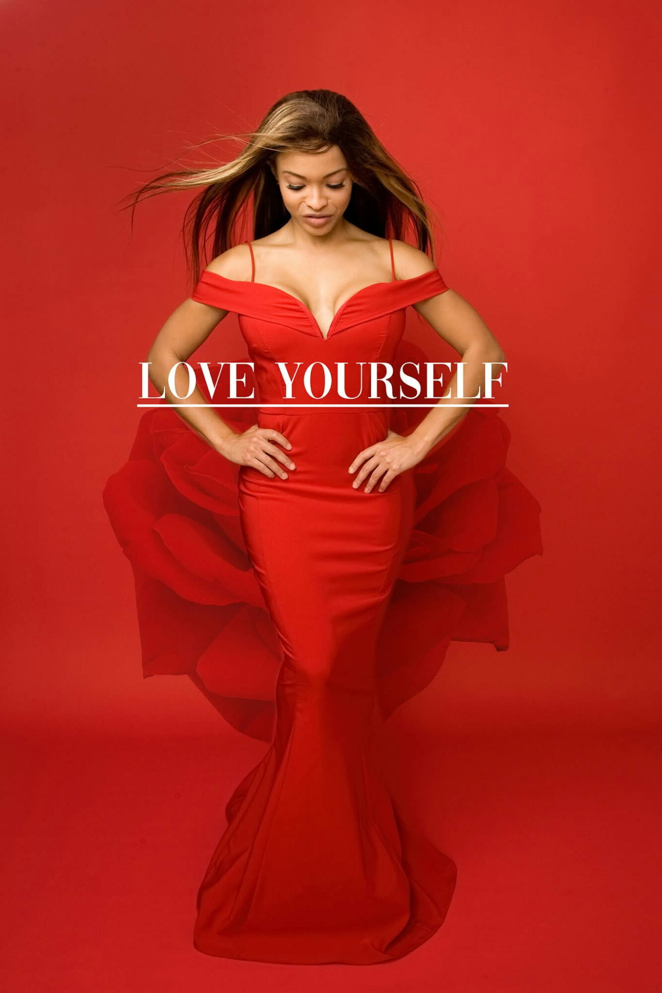 Woman in a red dress with flowing hair, standing against a red background, with the text 'LOVE YOURSELF' across her midsection.