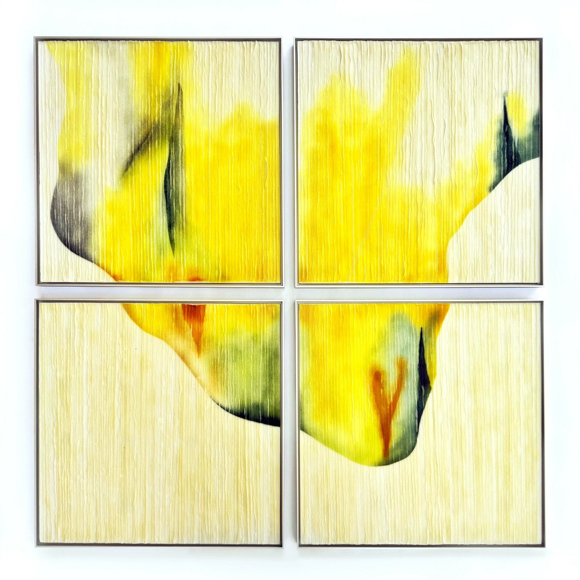 Four abstract paintings with yellow, black, and green colors arranged in a 2x2 grid.