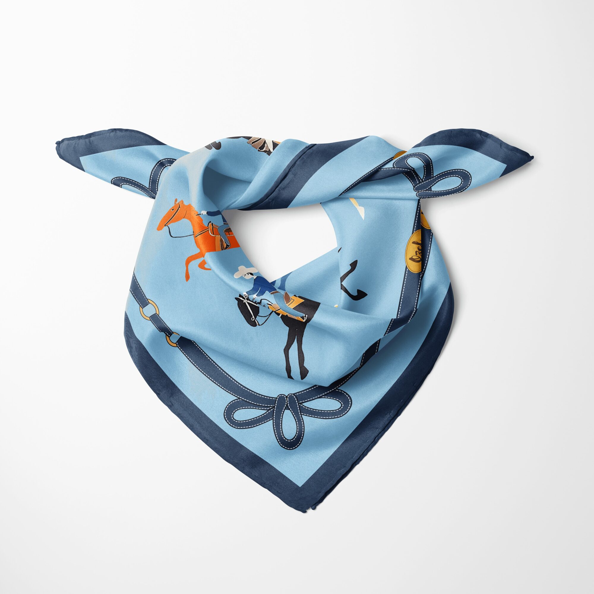 Blue patterned scarf with animals and objects, tied in a knot, on a white background.