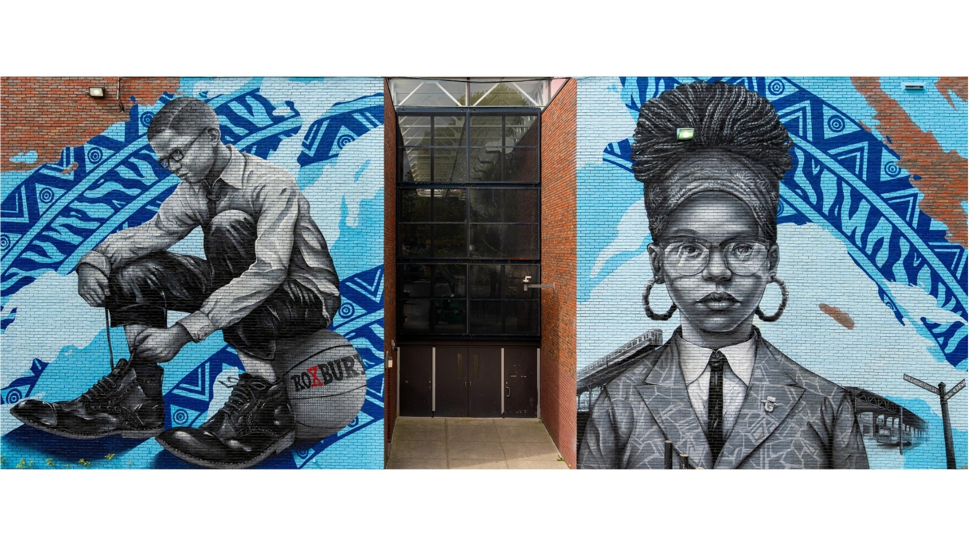 Two murals of children, one boy crouching and one girl with glasses, with a door in the center. Bright colors and patterns.