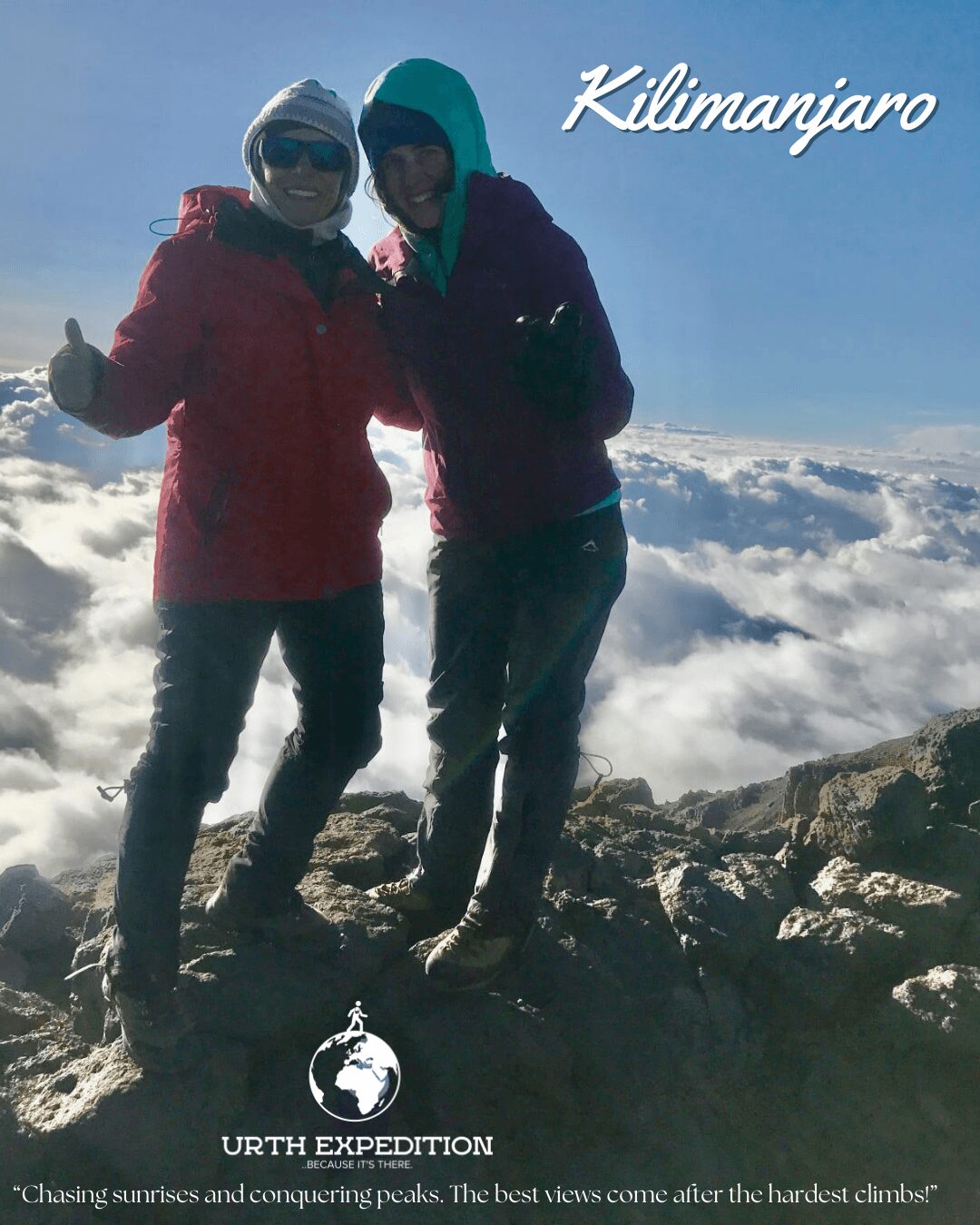 Two people standing on rocky terrain above clouds, wearing winter clothing, with the word 'Kilimanjaro' in the sky.