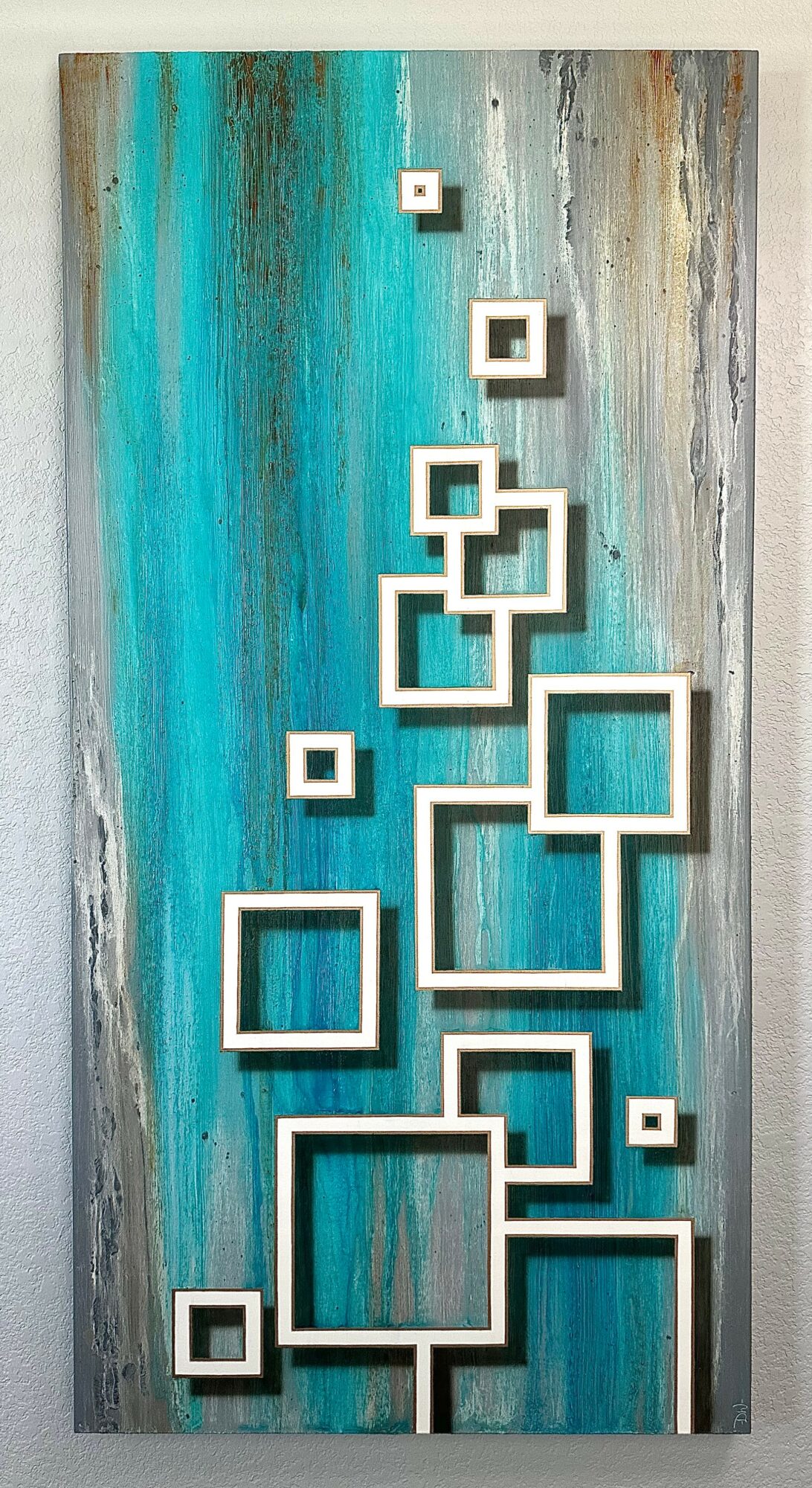 Vertical artwork with blue, gray, and beige tones featuring white geometric squares arranged in a pattern.