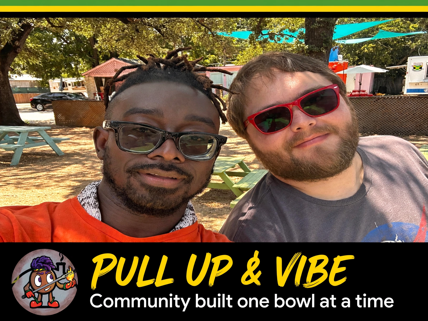 Two men outdoors, one with glasses and dreadlocks, the other with sunglasses and a beard, smiling in sunny weather.