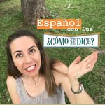 Young woman smiling outdoors, gesturing with her hand, with text about Spanish language and pronunciation, in a park setting.