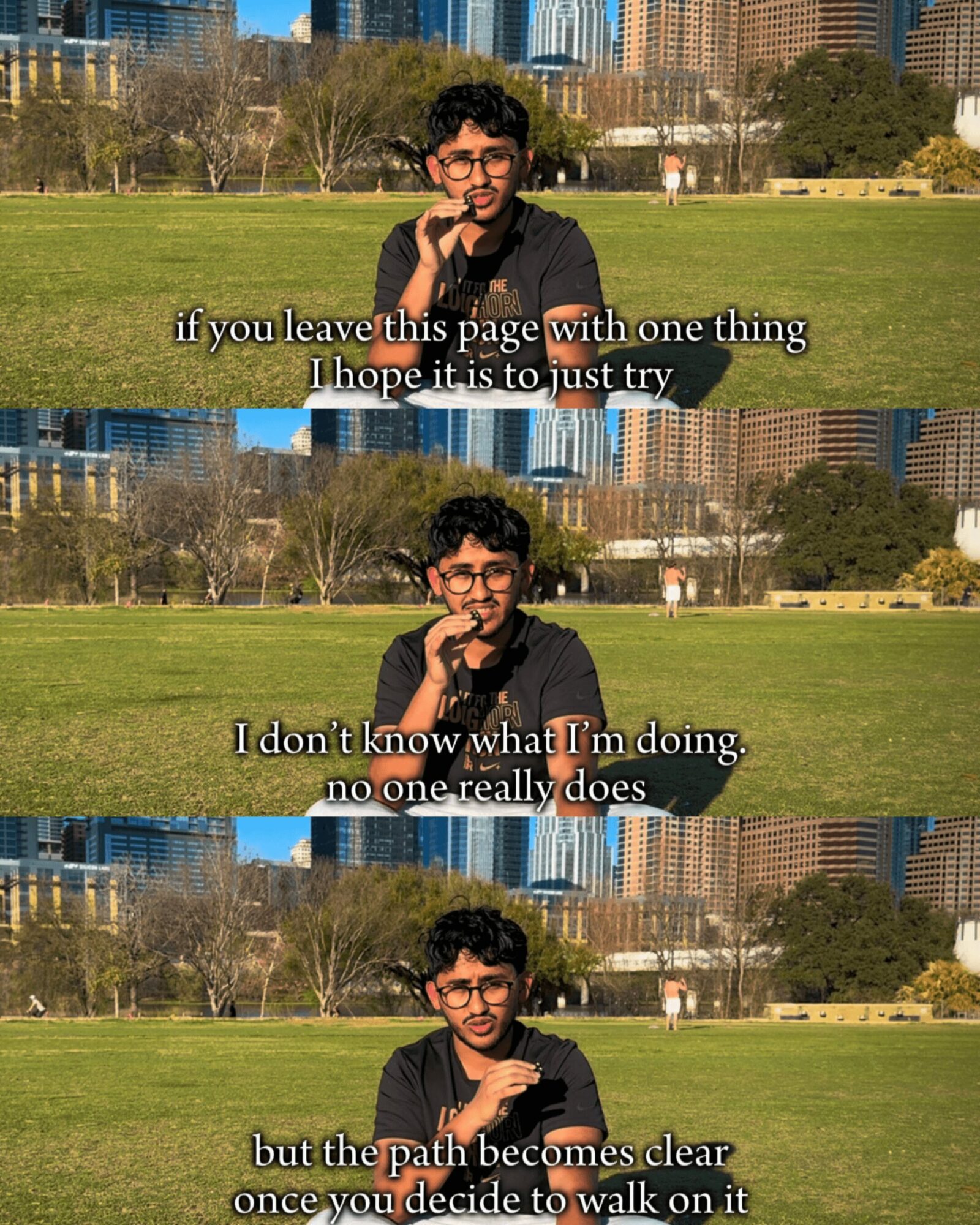 Young man with glasses and curly hair sitting outdoors with city skyline in background, holding a microphone, smiling, with lyrics overlayed.