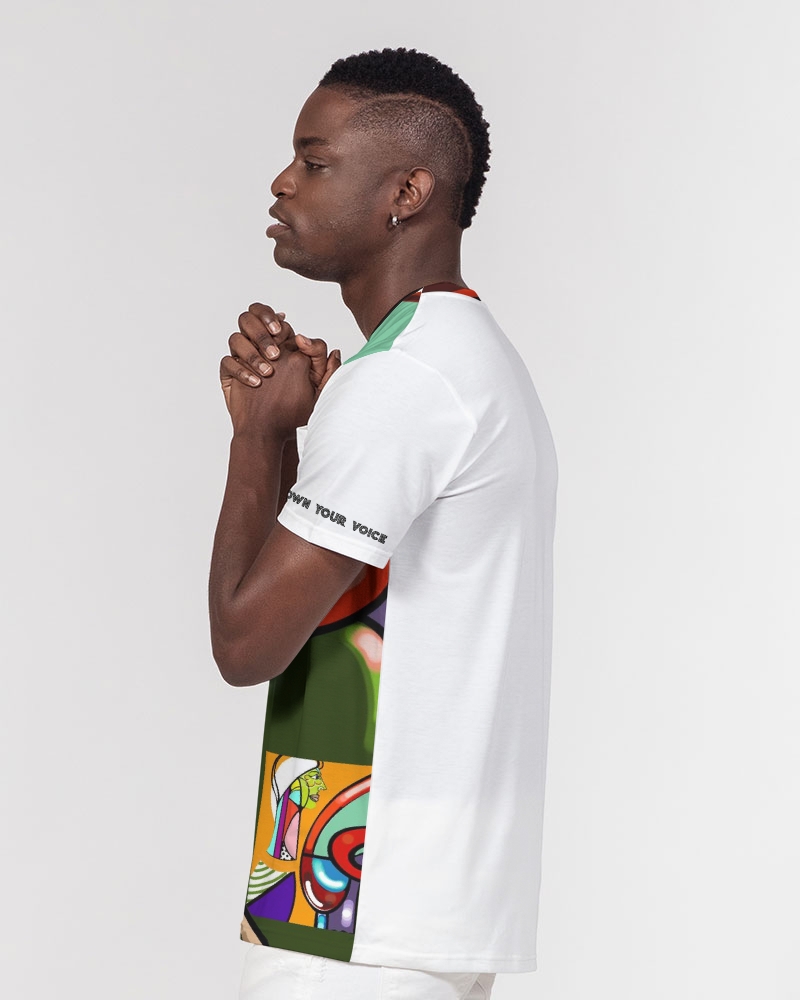Young man in a white T-shirt with colorful graphic design on the side, standing sideways with hands clasped, against a plain background.