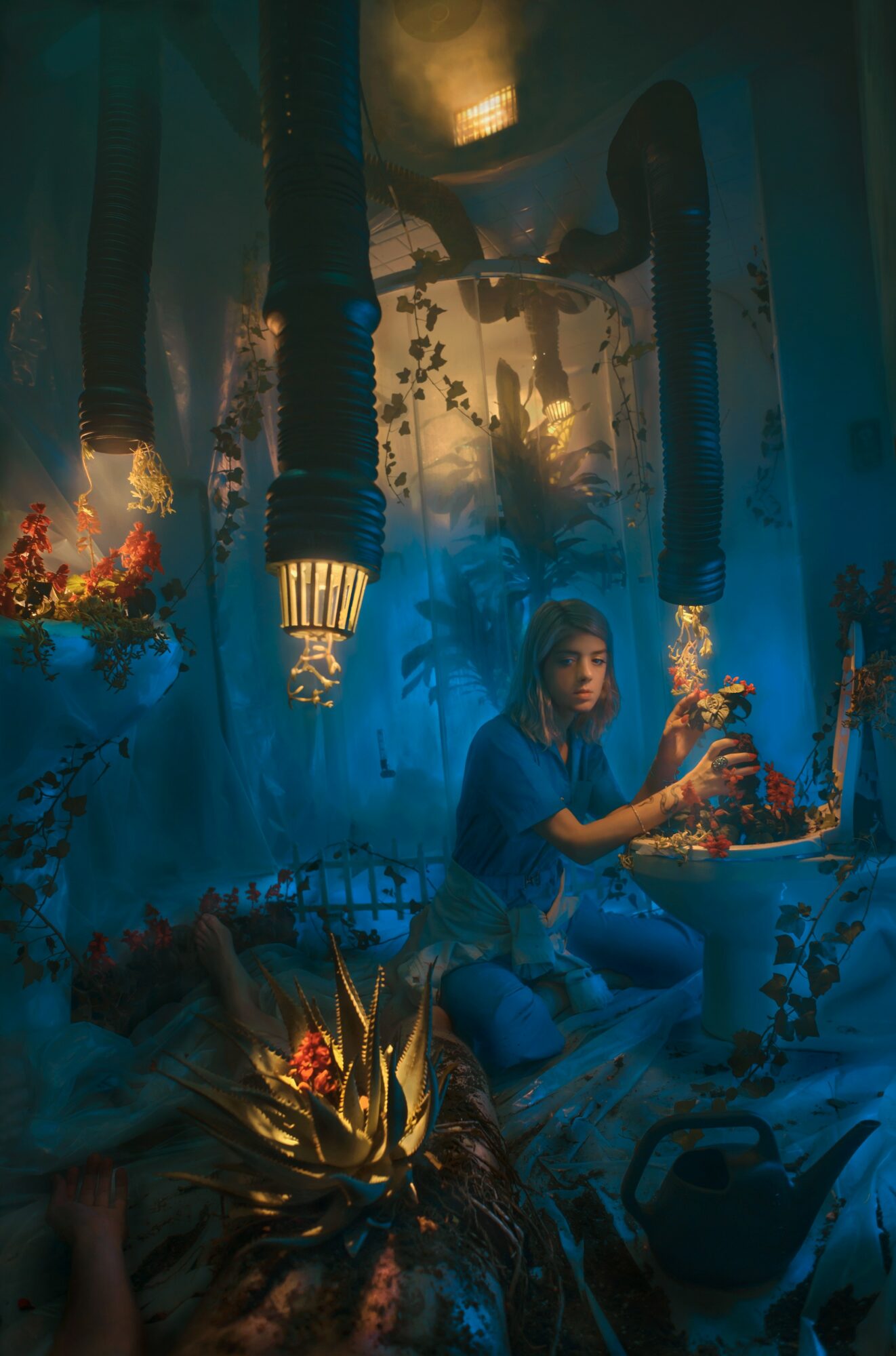 Person sitting in a decorated room with blue lighting, plants, and hanging objects, holding a glass. Word count: 20.