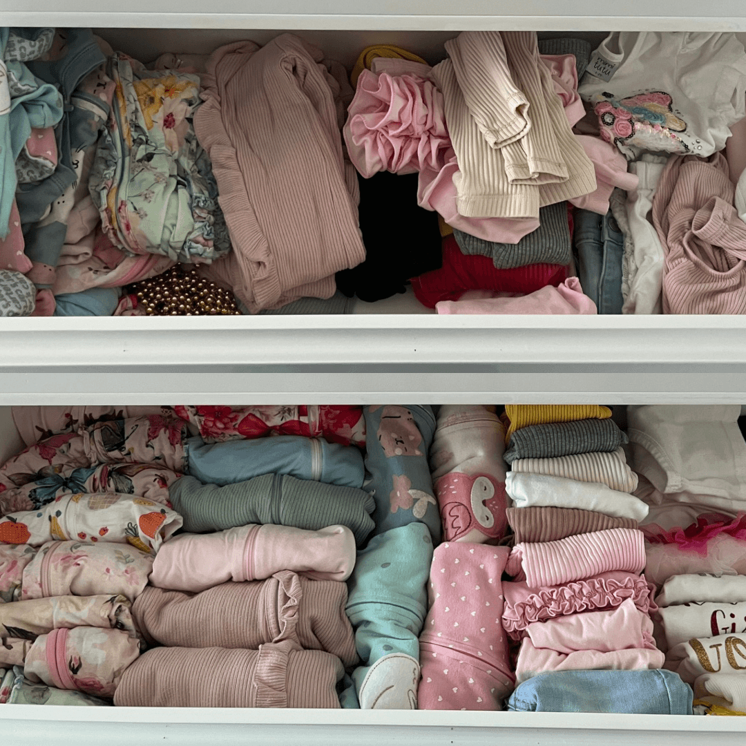 Two drawers filled with folded children's clothing, including socks, pajamas, and shirts in various colors and patterns.