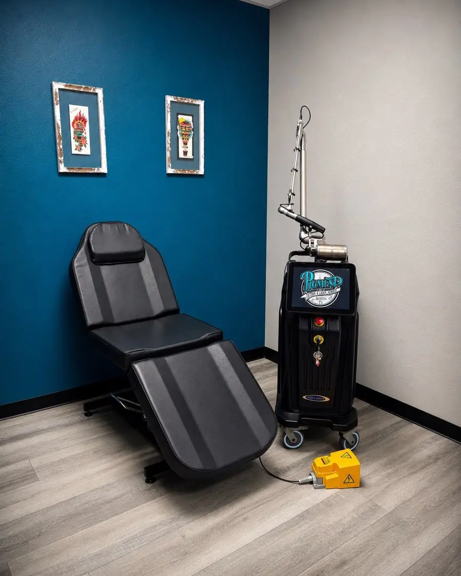 Medical examination chair in a room with blue and white walls, framed artwork, and medical equipment on a cart.