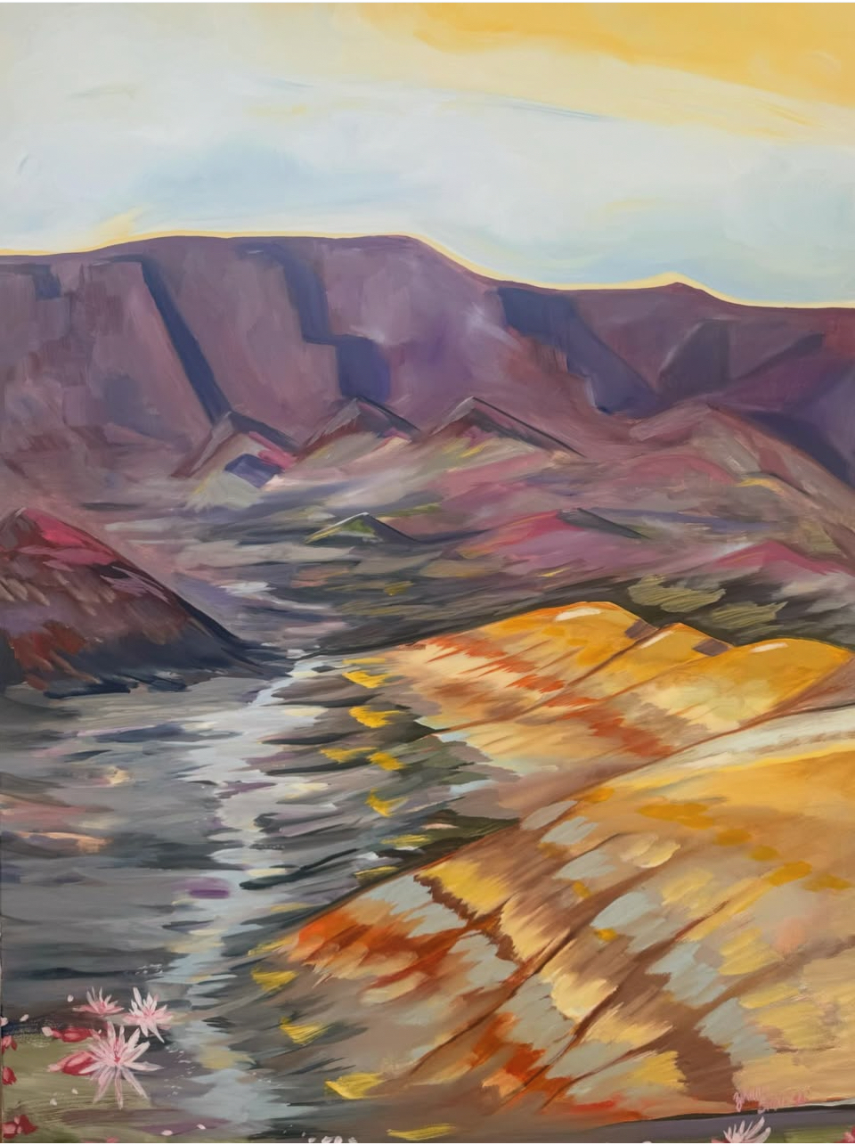 Landscape painting of mountains, water, and colorful rocks with a sky background.