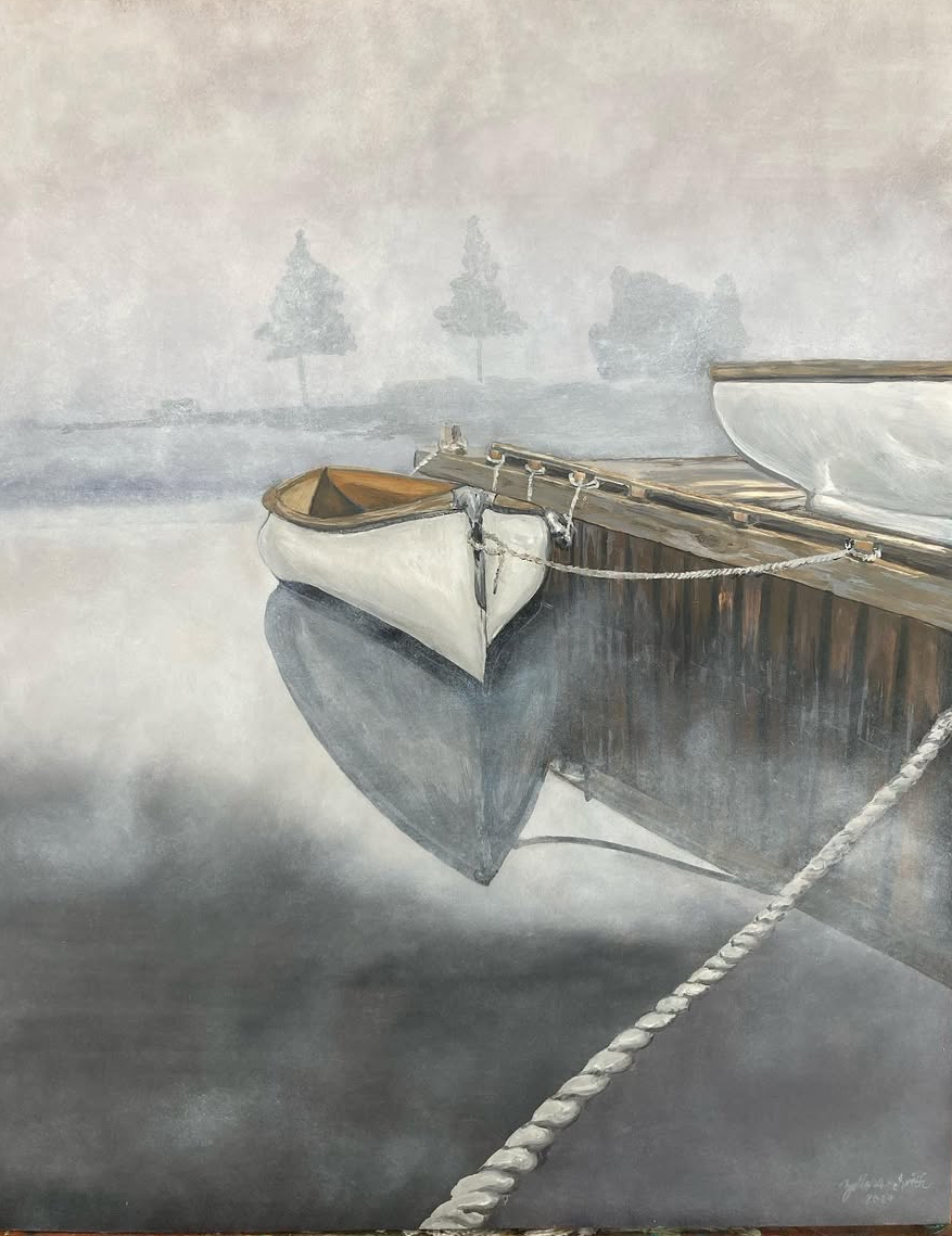 Two boats are moored on calm water, with their reflections visible. Faint trees are in the background.