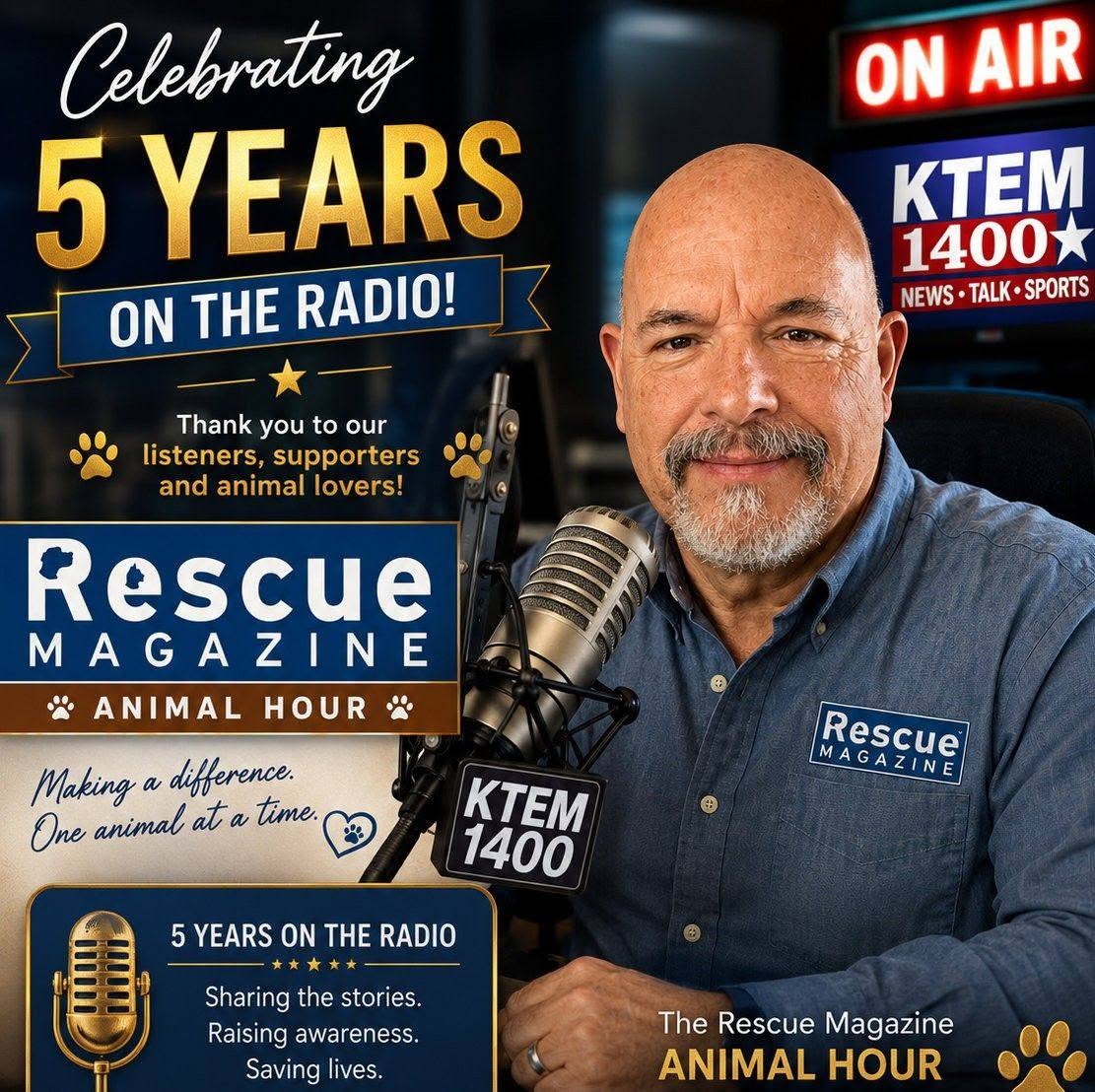 Man with a beard in a blue shirt in a radio studio, celebrating five years on air, with logos and signs around him.