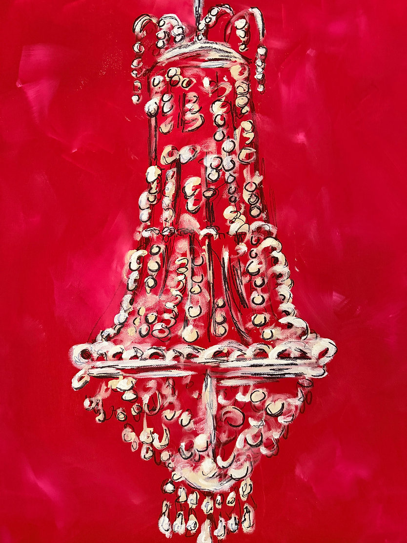 A chandelier with multiple tiers and hanging crystals against a red background.
