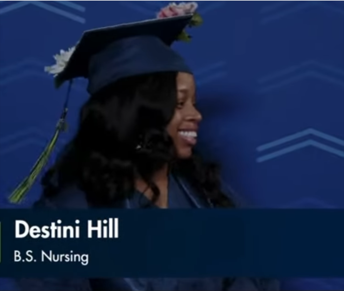 Smiling woman in graduation cap and gown, blue background, text with name and degree, side profile.