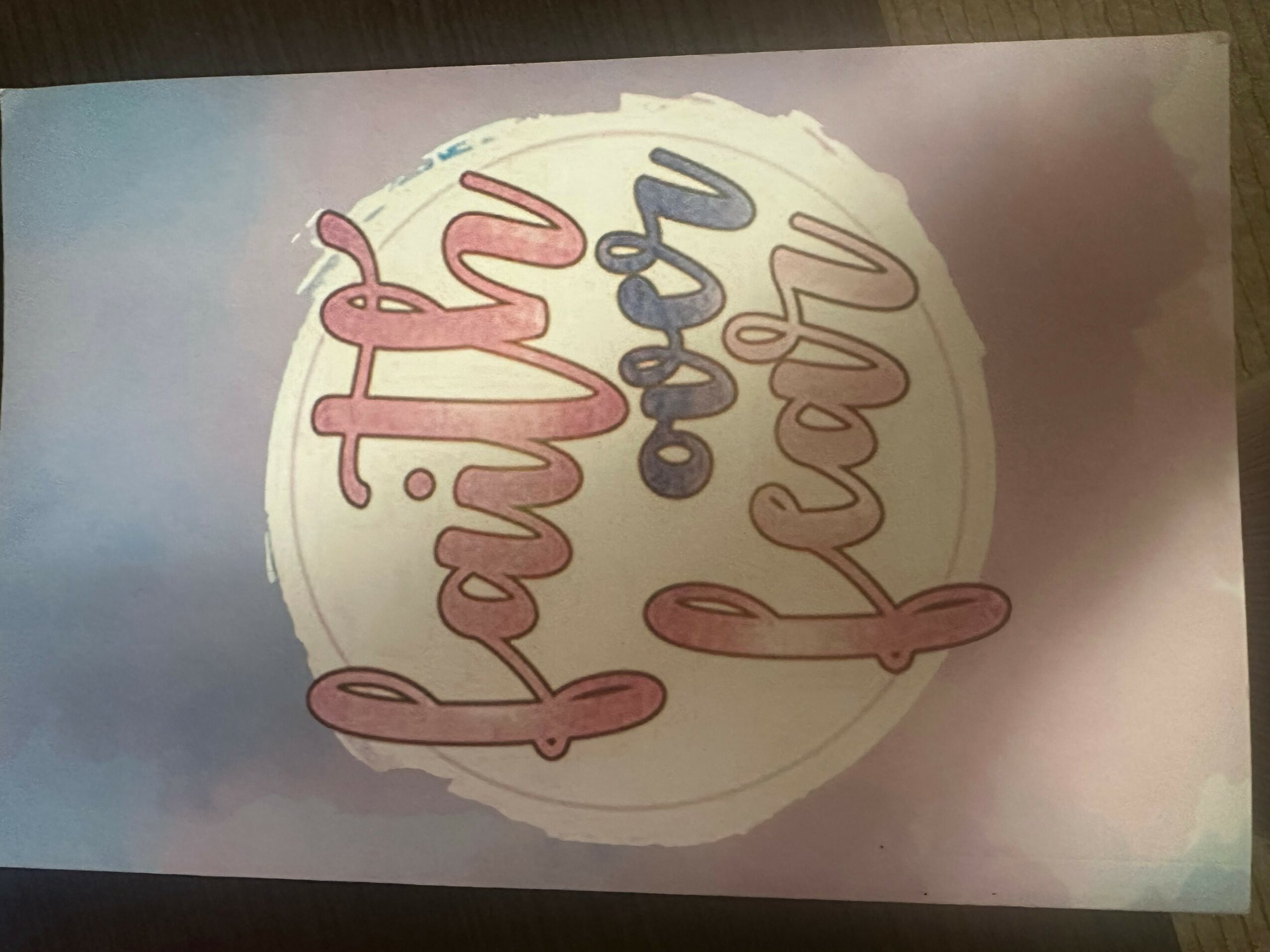 Text reads 'faith over fear' with a circular background, in pastel colors, rotated 90 degrees clockwise.