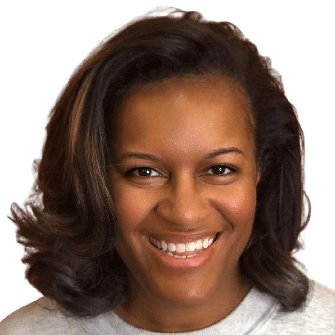Smiling woman with shoulder-length hair wearing a light-colored top, facing forward.