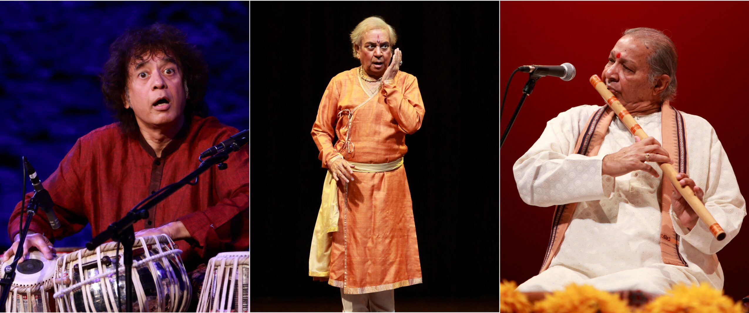 Three musicians performing: a person playing tabla, a person standing with hands clasped, a person playing flute, all on stage.