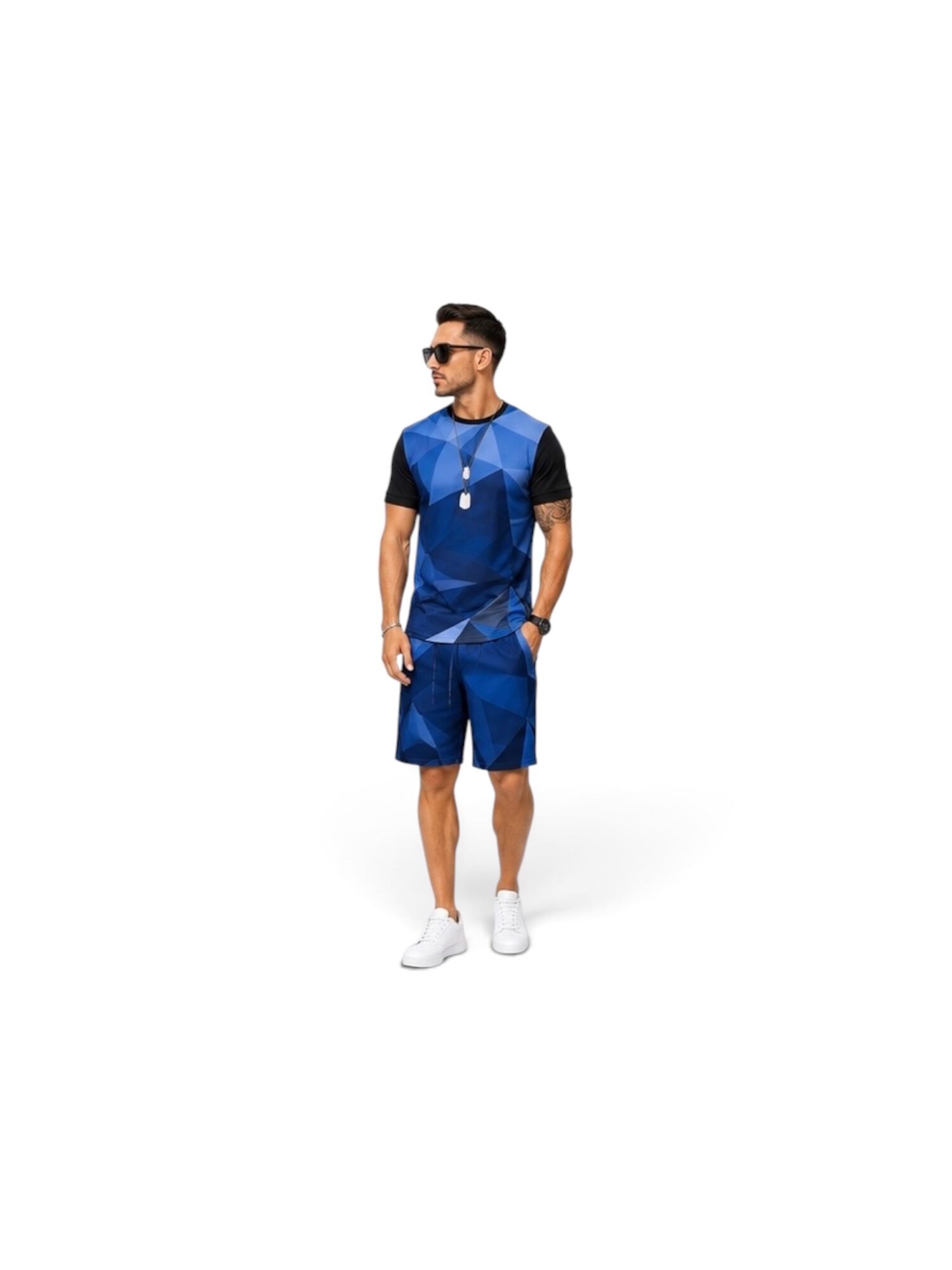 Young man in sunglasses wearing a blue and black color-blocked shirt and blue shorts, standing with hands in pockets, facing left.