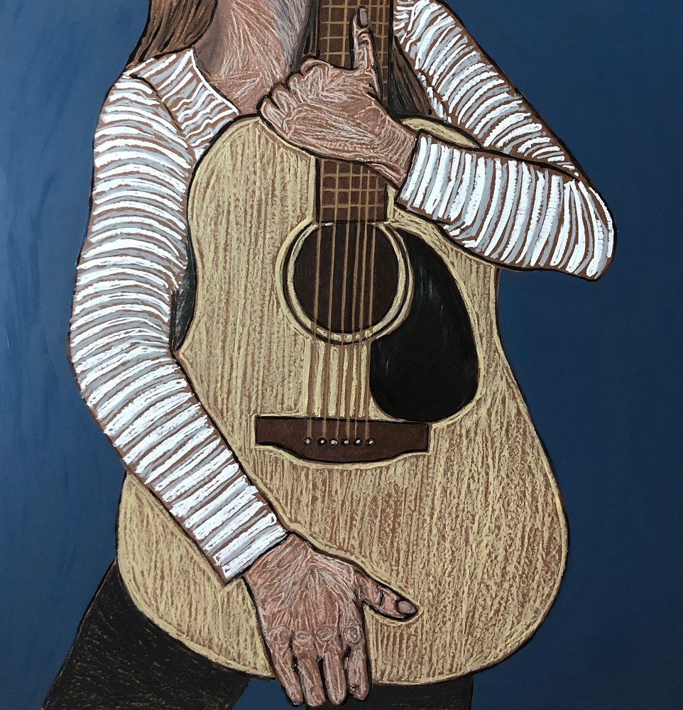 Person holding an acoustic guitar, wearing a striped long-sleeve shirt, with a dark background.
