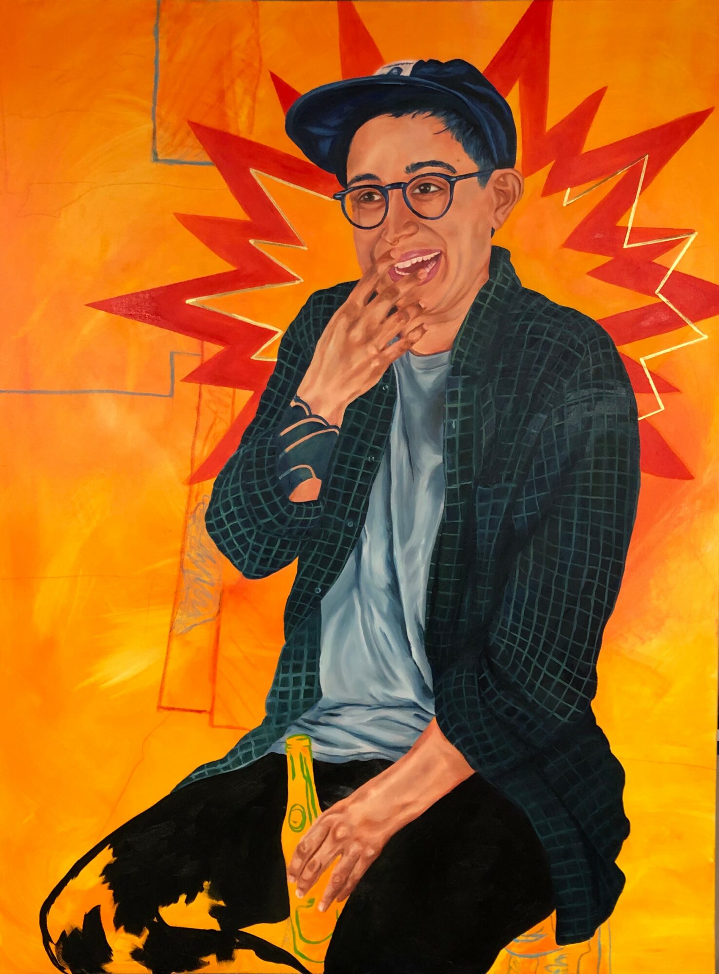Person with glasses and a hat, smiling, holding a yellow object, in front of an orange background with red starburst design.