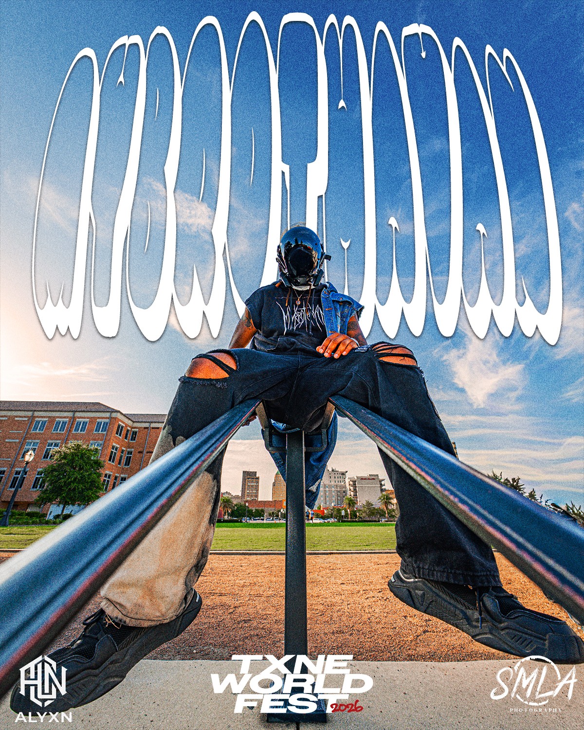 Person sitting on a railing outdoors with large stylized text in the sky background, buildings and sky visible.