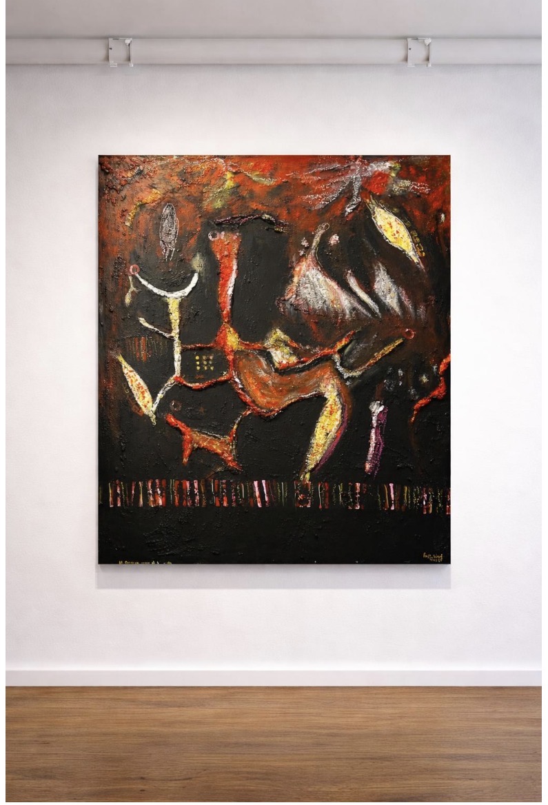 Abstract painting with dark, fiery colors and bold brushstrokes, displayed on a white wall with wooden floor.