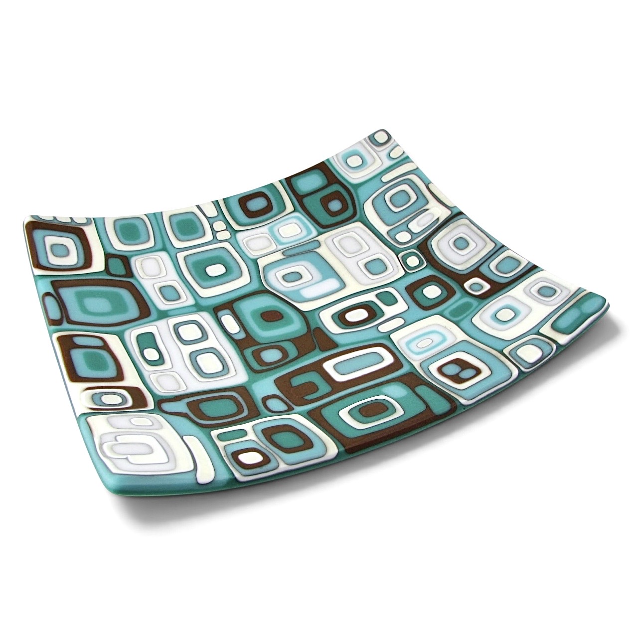 Decorative square-patterned plate with blue, white, black, and brown geometric designs, slightly curved edges.