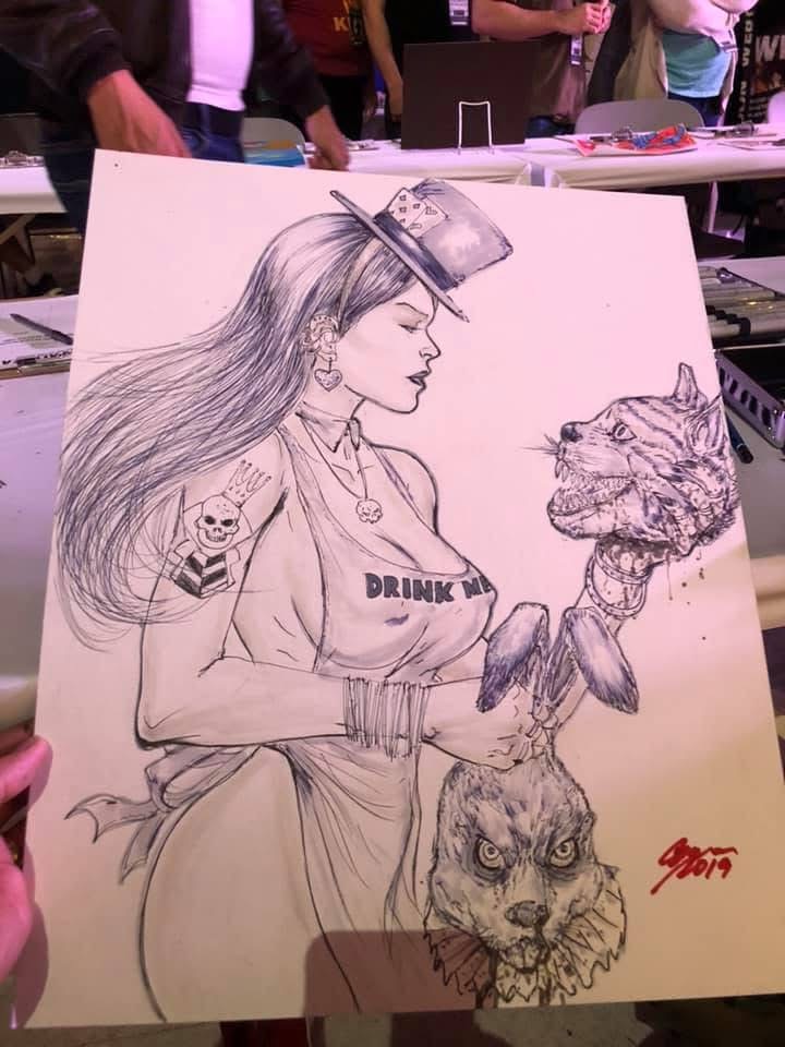 Detailed pencil drawing of a woman with long hair, a hat, and a tattoo, holding a fish, with a lion's face below.