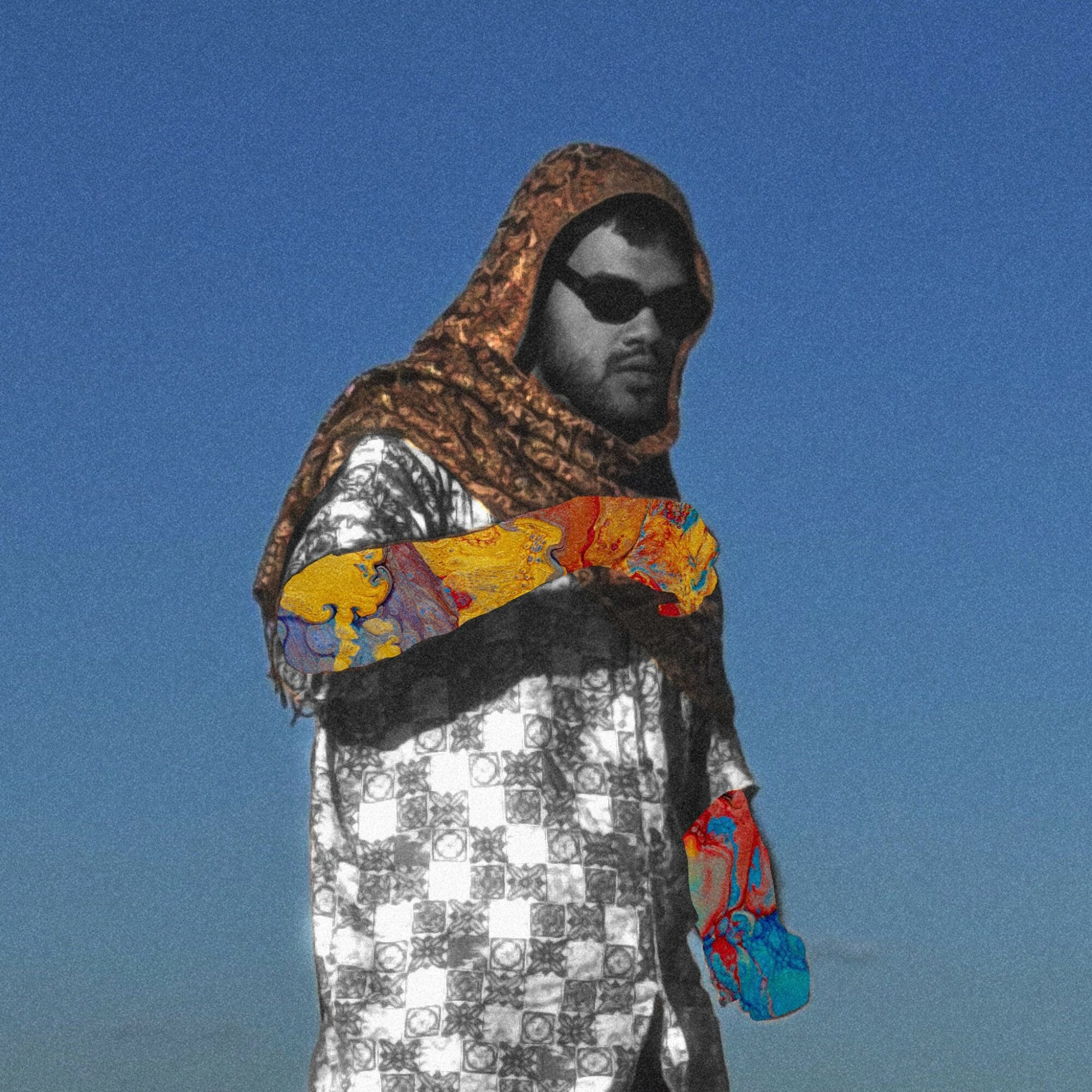 Person wearing sunglasses and a patterned outfit, holding a colorful object, against a blue sky background.