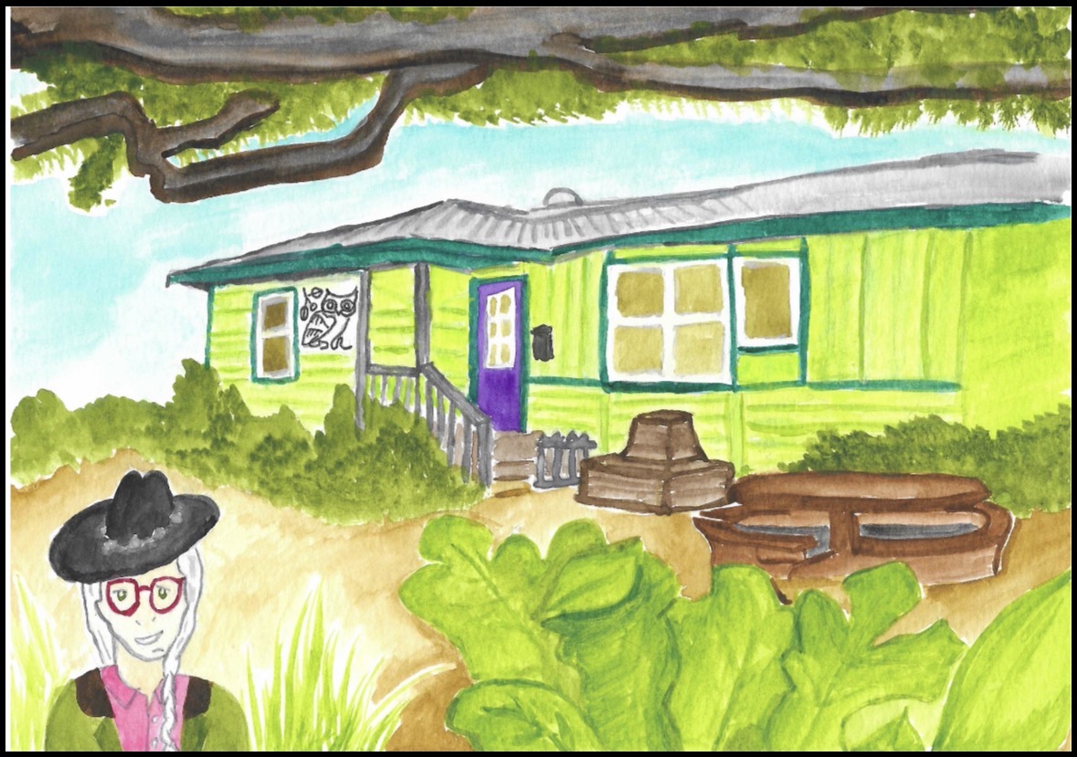 A person stands among leafy plants in front of a bright green house and wooden outdoor furniture.