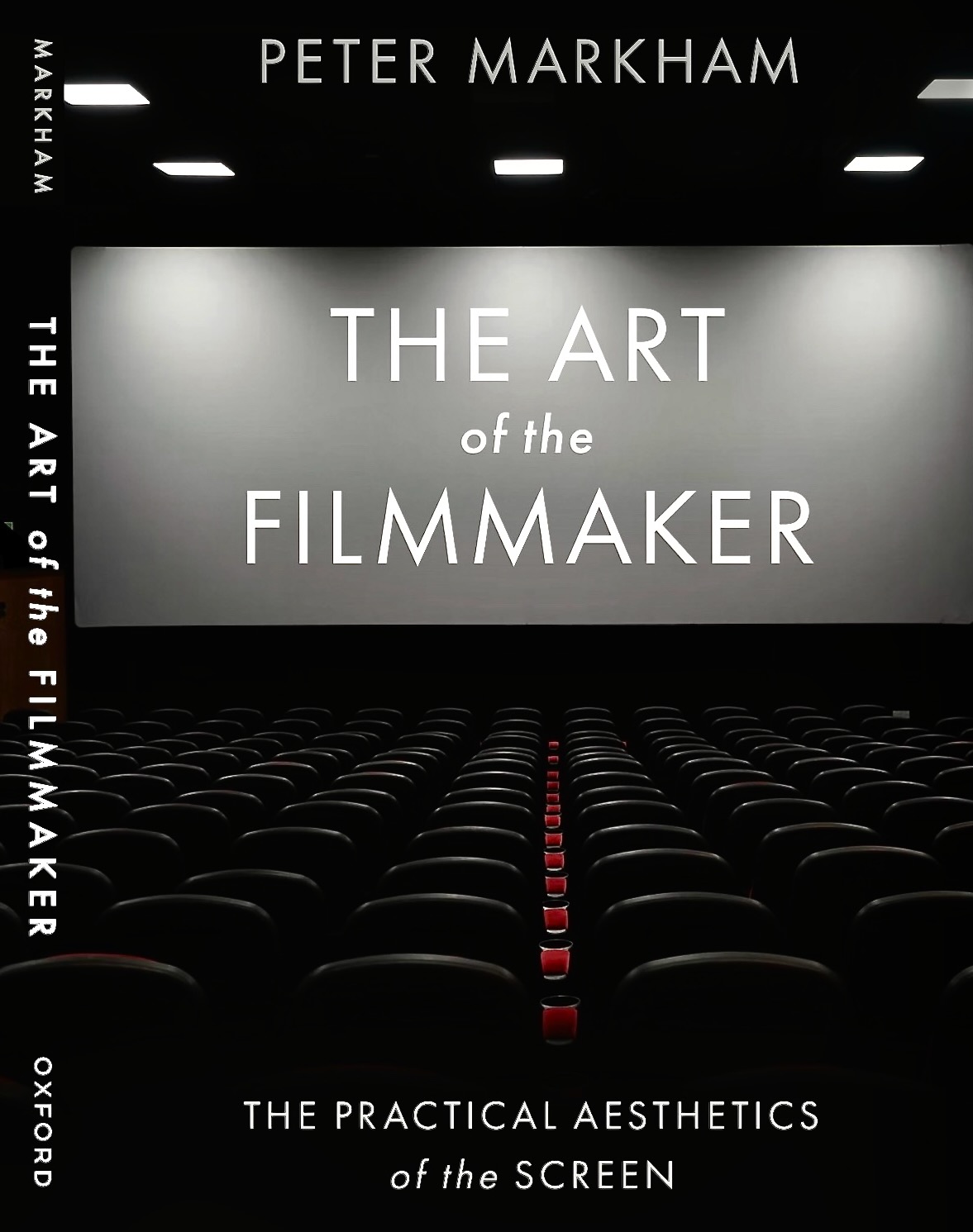 Book cover titled 'The Art of the Filmmaker' by Peter Markham, featuring a dark movie theater with empty seats and a large screen.