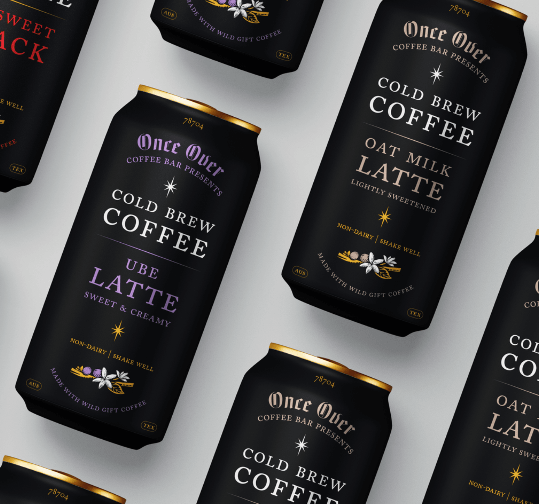Multiple cans of Once Over Cold Brew Coffee Latte with black and gold packaging, arranged diagonally.