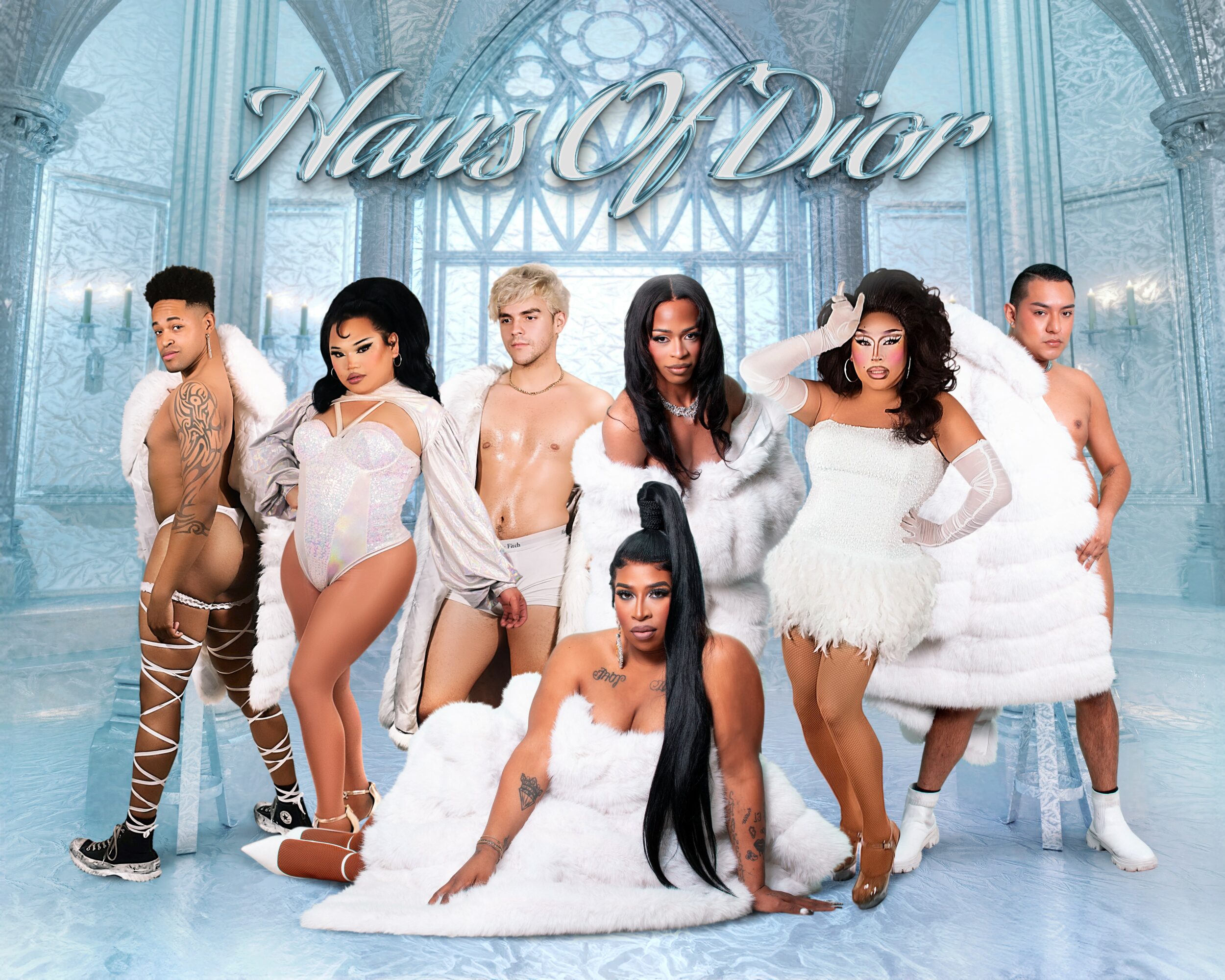 Group of seven diverse people in white and beige outfits in a grand, icy blue setting with 'Nuits D'Eté' text above.