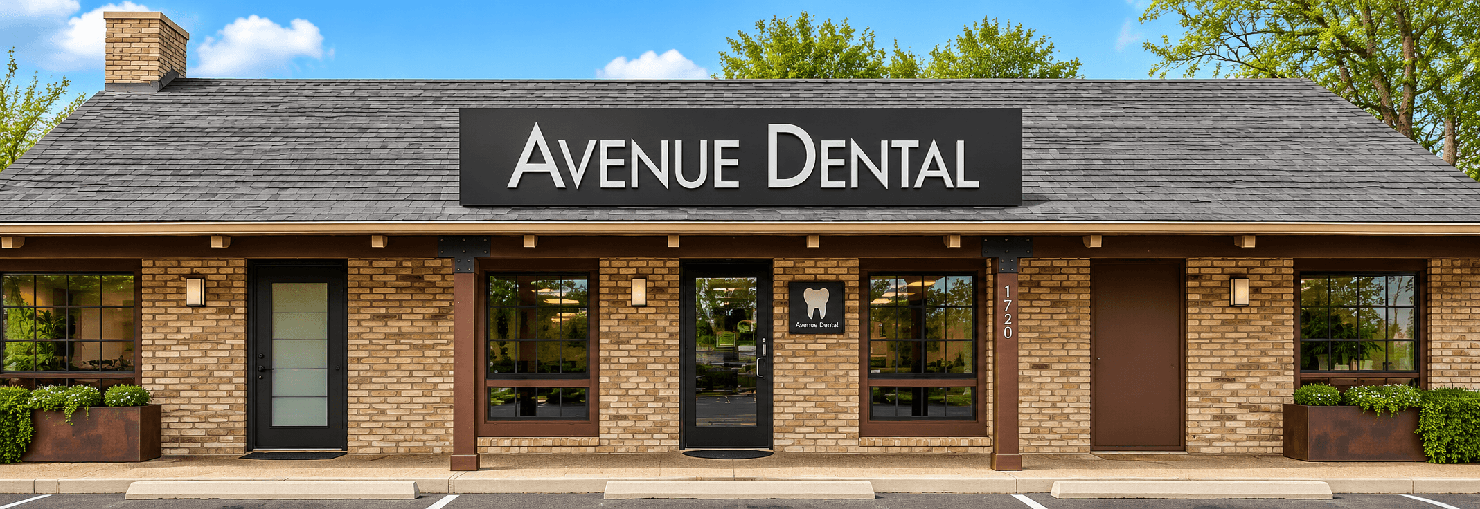 Street-facing view of a brick dental office with a sign reading “Avenue Dental.”