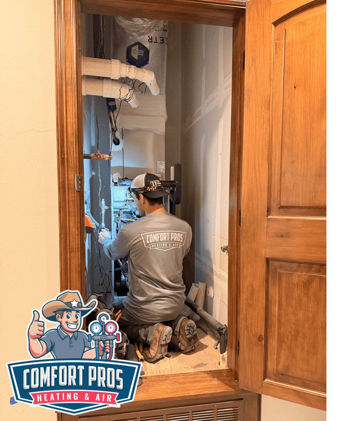 A technician works inside a narrow utility closet beside a heating system, with a Comfort Pros logo overlay at the lower left.